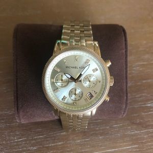 Women’s Michael Kors gold watch